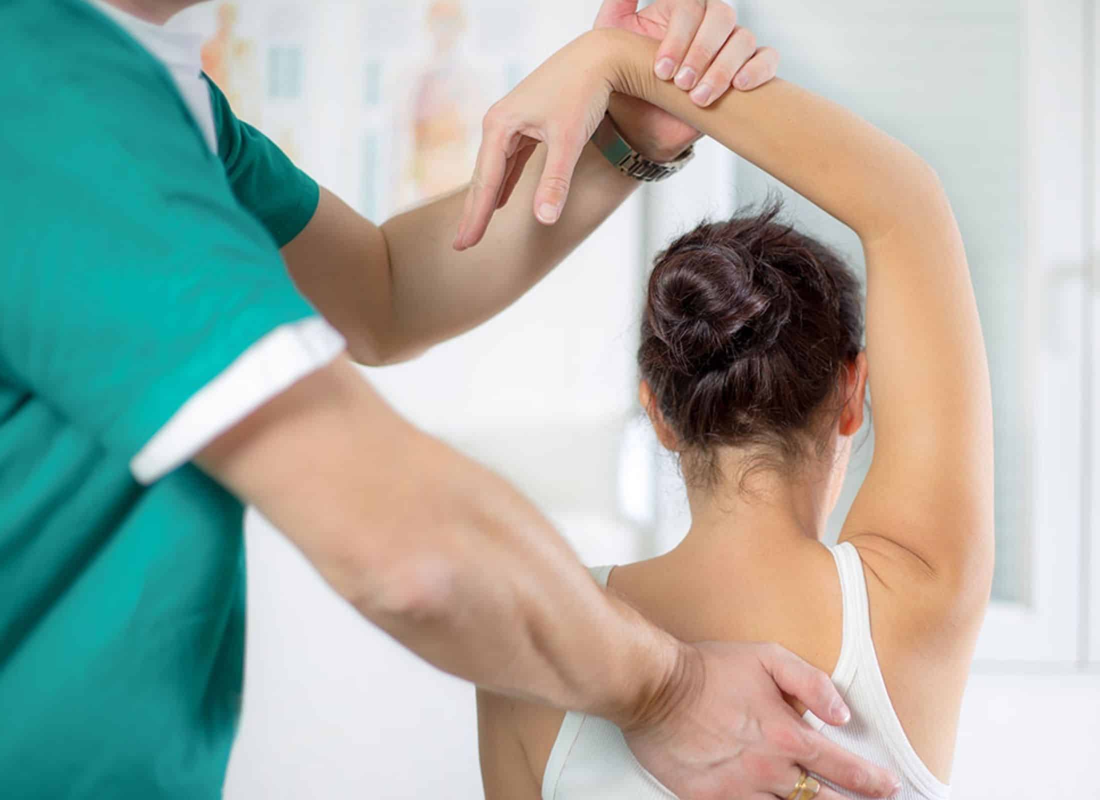 a person stretching a woman's back