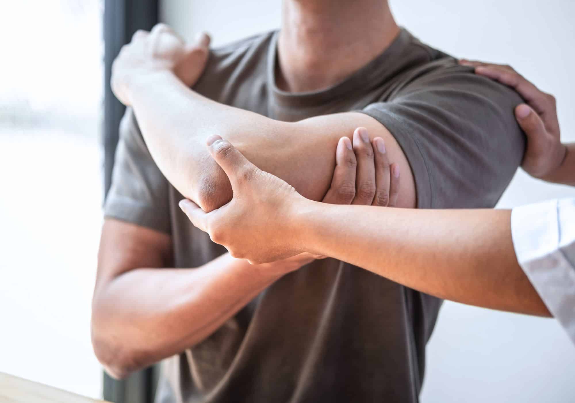 a person holding a person's elbow